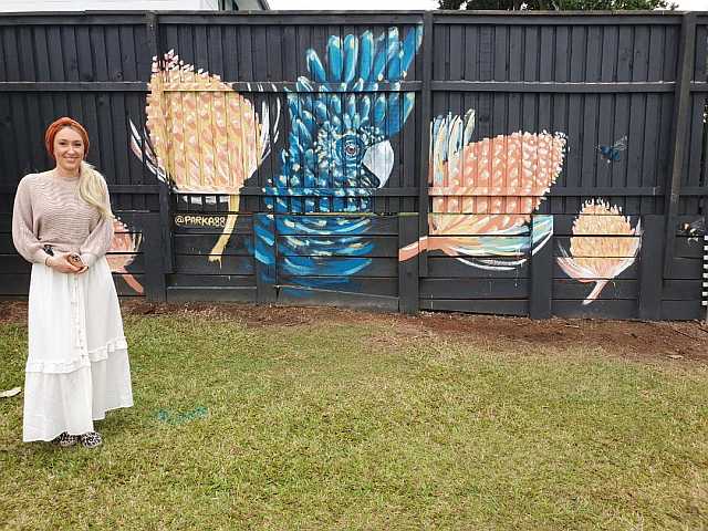 Emma and Mural at Tarragindi Community Garden